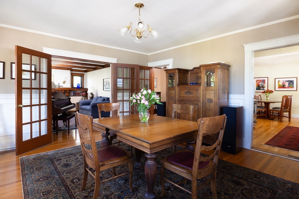 139 University Road, Unit 2 Brookline, MA 02445 - Photo 6 of 16 a view of a dining room with furniture window and wooden floor
