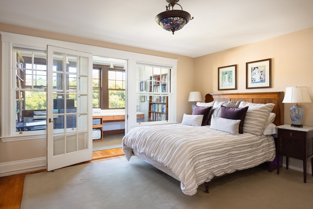 139 University Road, Unit 2 Brookline, MA 02445 - Photo 10 of 16 a bedroom with a large bed and a large window
