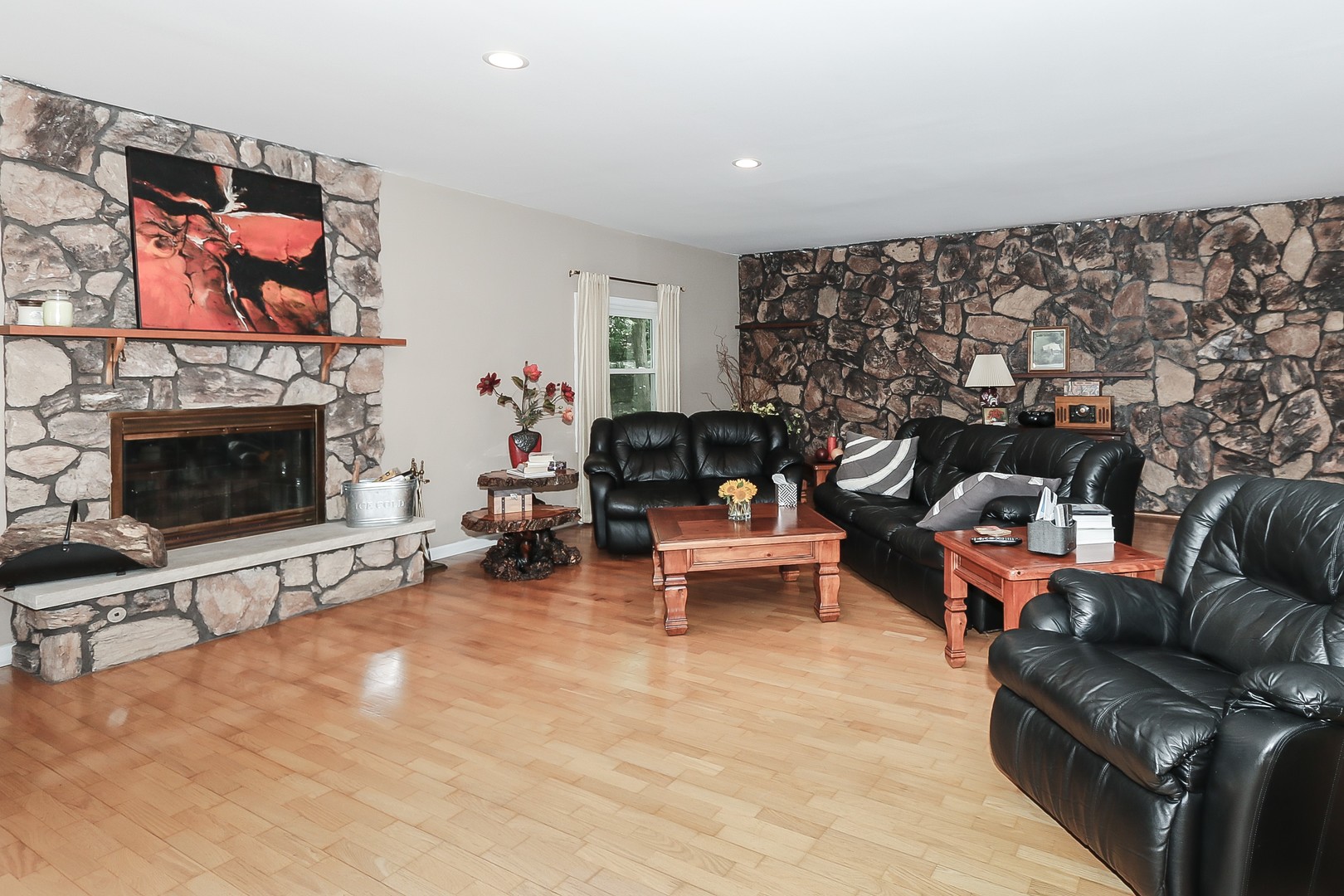 207 Ela Road Inverness, IL 60067 - Photo 12 of 30 a living room with furniture a flat screen tv and a fireplace
