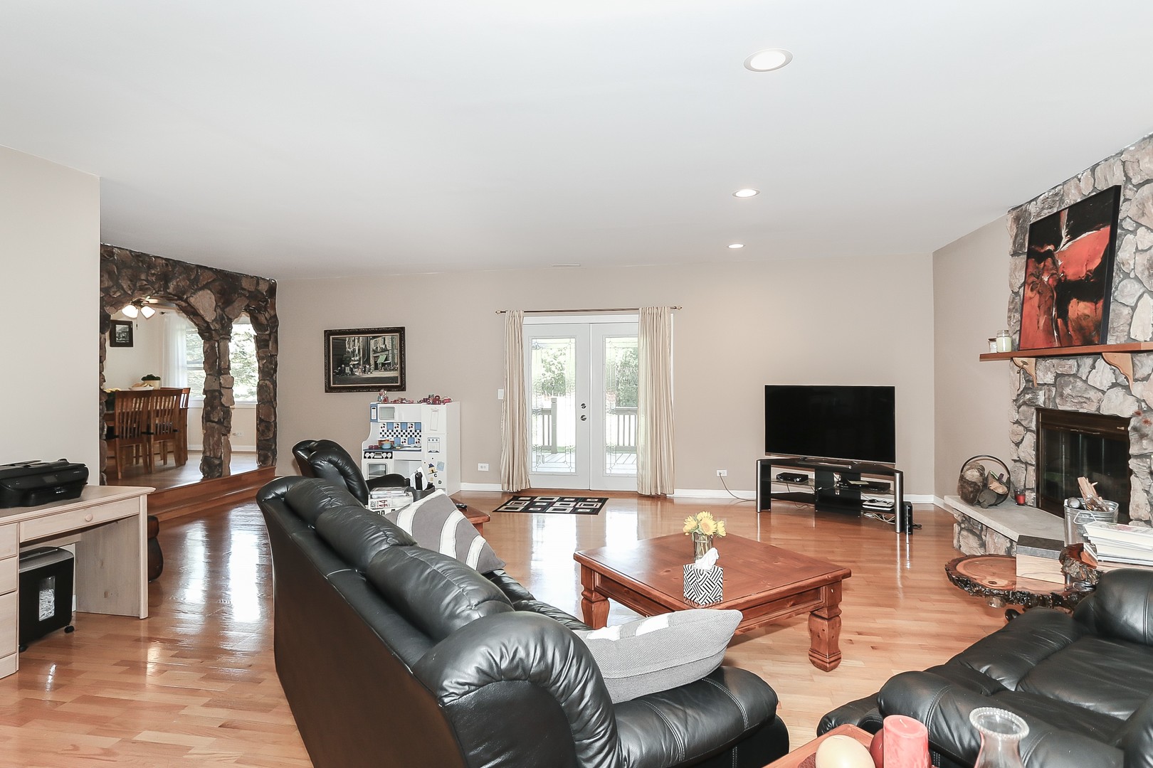 207 Ela Road Inverness, IL 60067 - Photo 13 of 30 a living room with fireplace furniture and a flat screen tv
