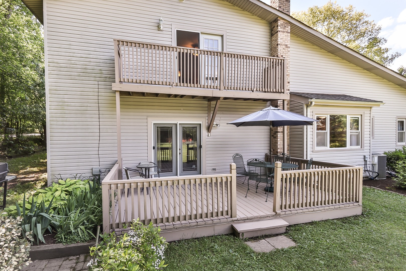 207 Ela Road Inverness, IL 60067 - Photo 27 of 30 a porch with a bench next to a yard