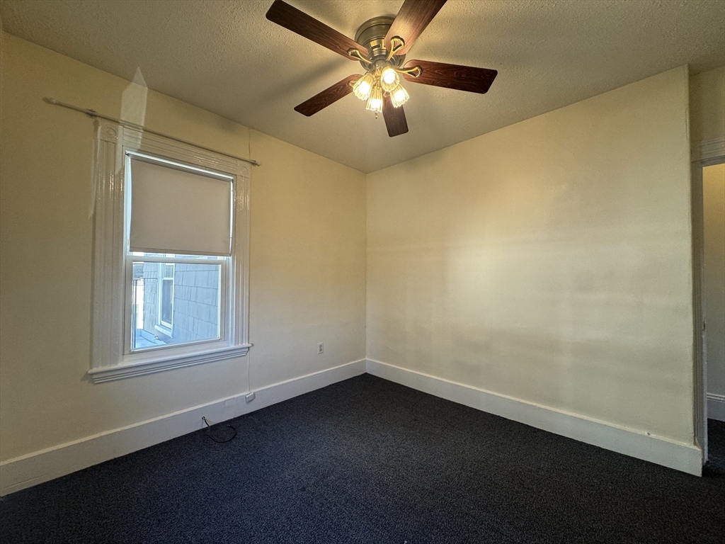 58 Hichborn Street, Unit 2 Boston, MA 02134 - Photo 11 of 15 an empty room with a window and a fan