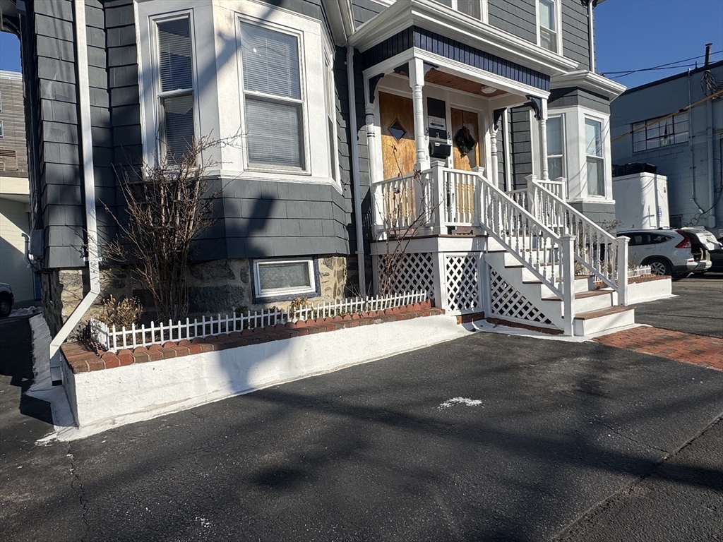 58 Hichborn Street, Unit 2 Boston, MA 02134 - Photo 14 of 15 a front view of a house with iron fence