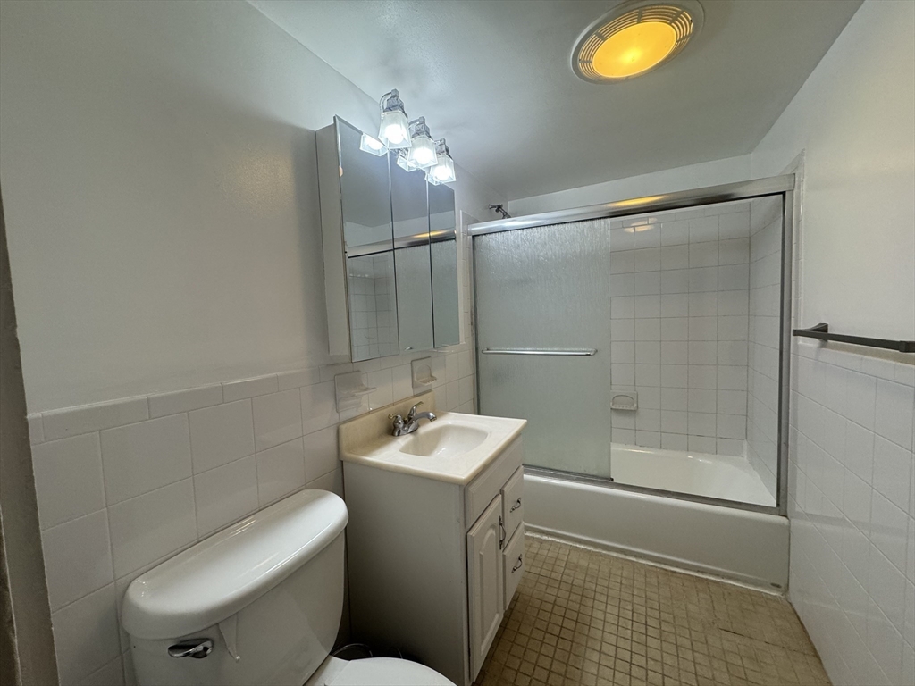 58 Hichborn Street, Unit 2 Boston, MA 02134 - Photo 8 of 15 a bathroom with a toilet a sink and shower