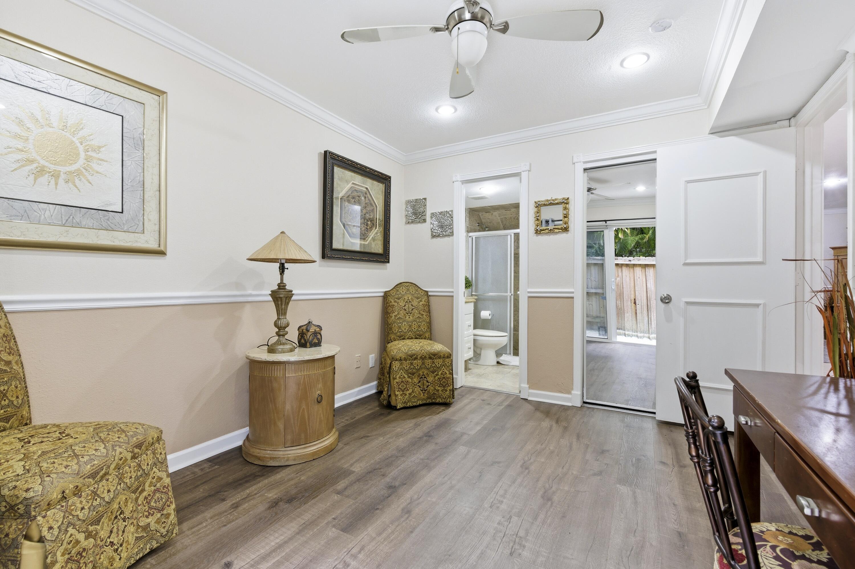 1945 Northwest 4th Avenue, Unit 43C Boca Raton, FL 33432 - Photo 12 of 23 a living room with furniture and wooden floor