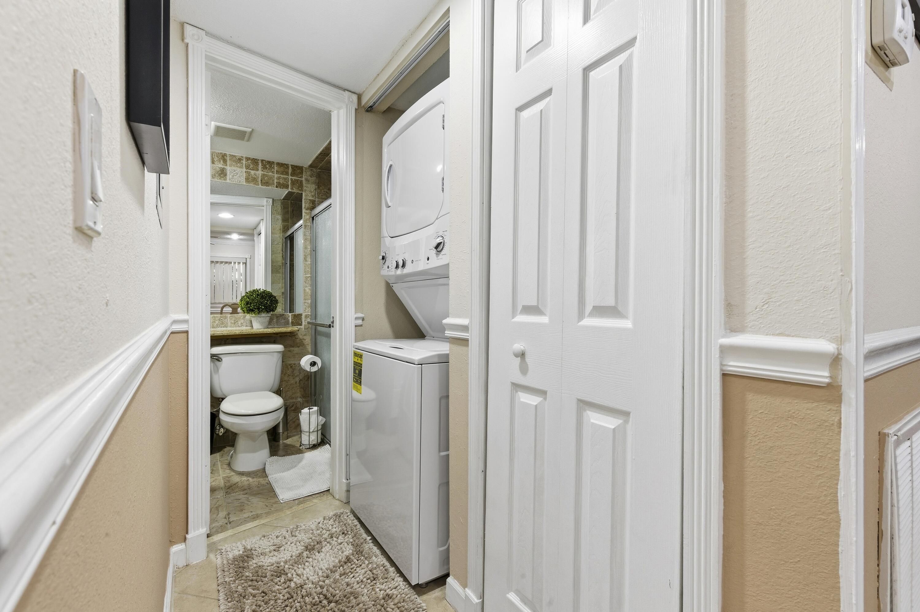 1945 Northwest 4th Avenue, Unit 43C Boca Raton, FL 33432 - Photo 15 of 23 a bathroom with a sink a toilet and a shower