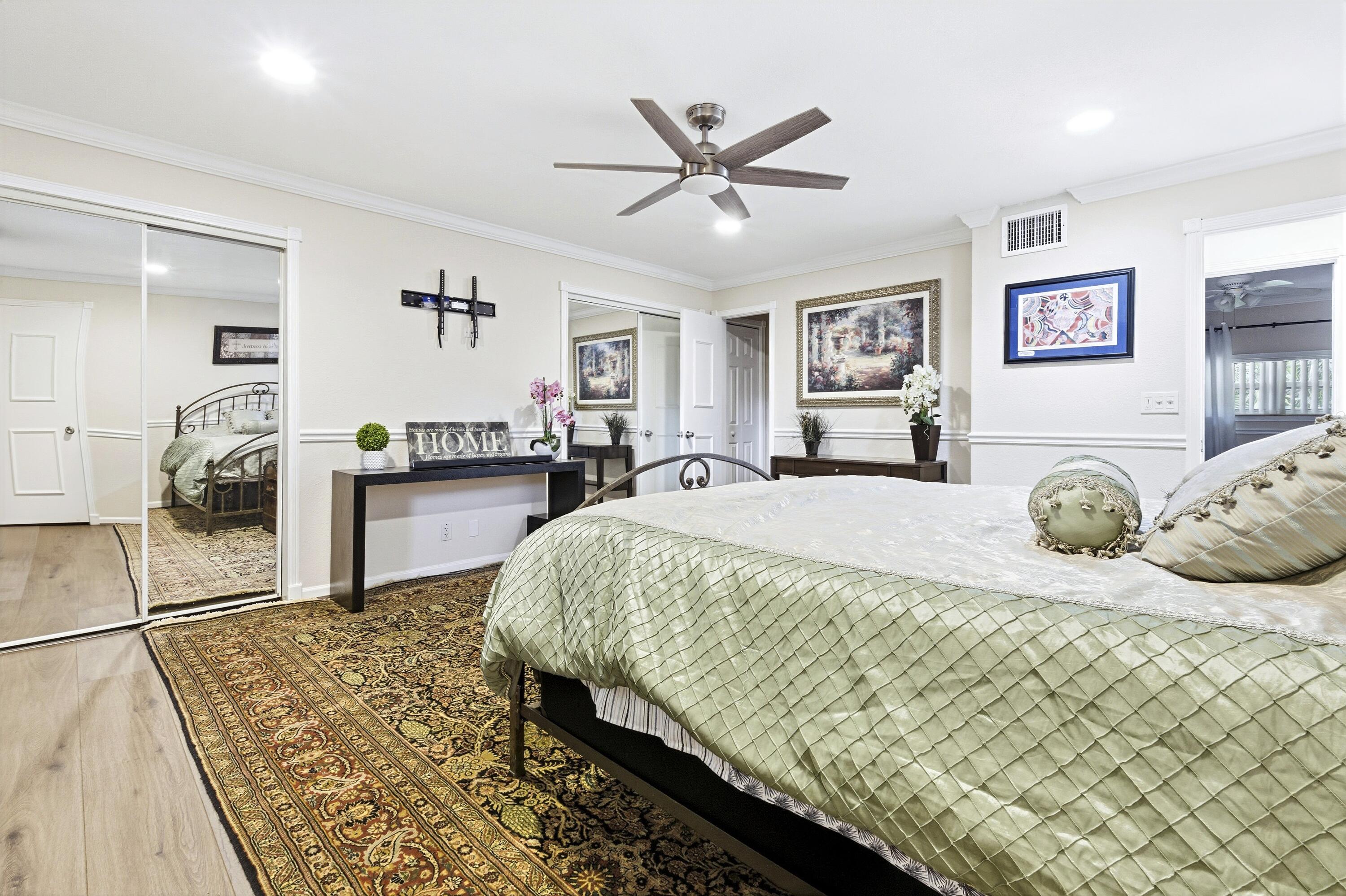 1945 Northwest 4th Avenue, Unit 43C Boca Raton, FL 33432 - Photo 17 of 23 a spacious bedroom with a bed and dresser