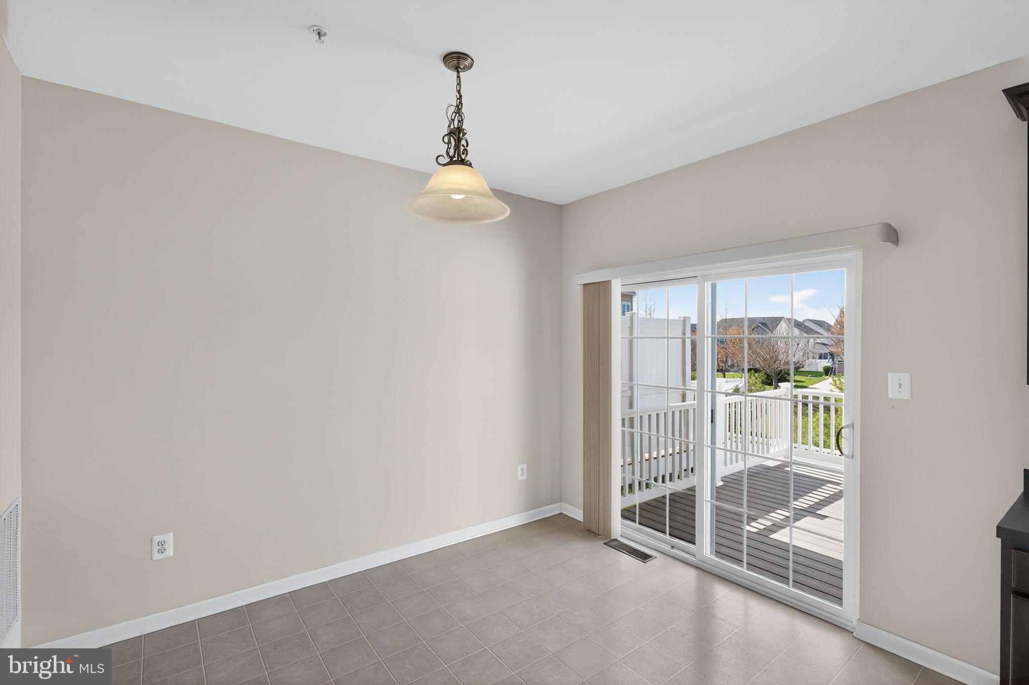 11831 Sunset Ridge Place Waldorf, MD 20602 - Photo 13 of 24 a view of an empty room with glass door