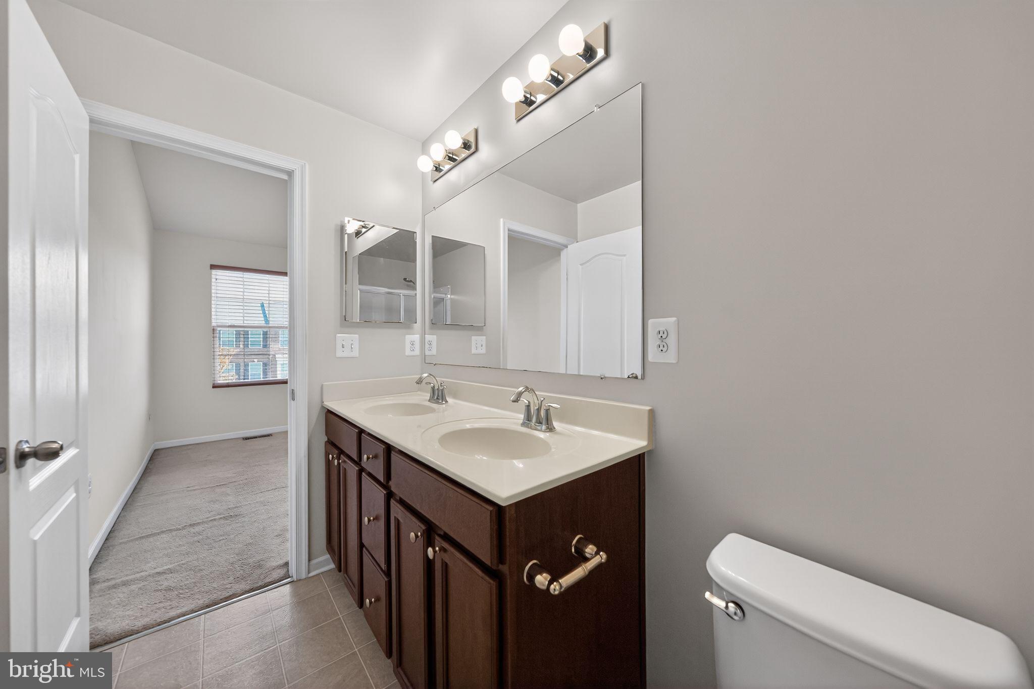 11831 Sunset Ridge Place Waldorf, MD 20602 - Photo 18 of 24 a bathroom with a sink and a toilet