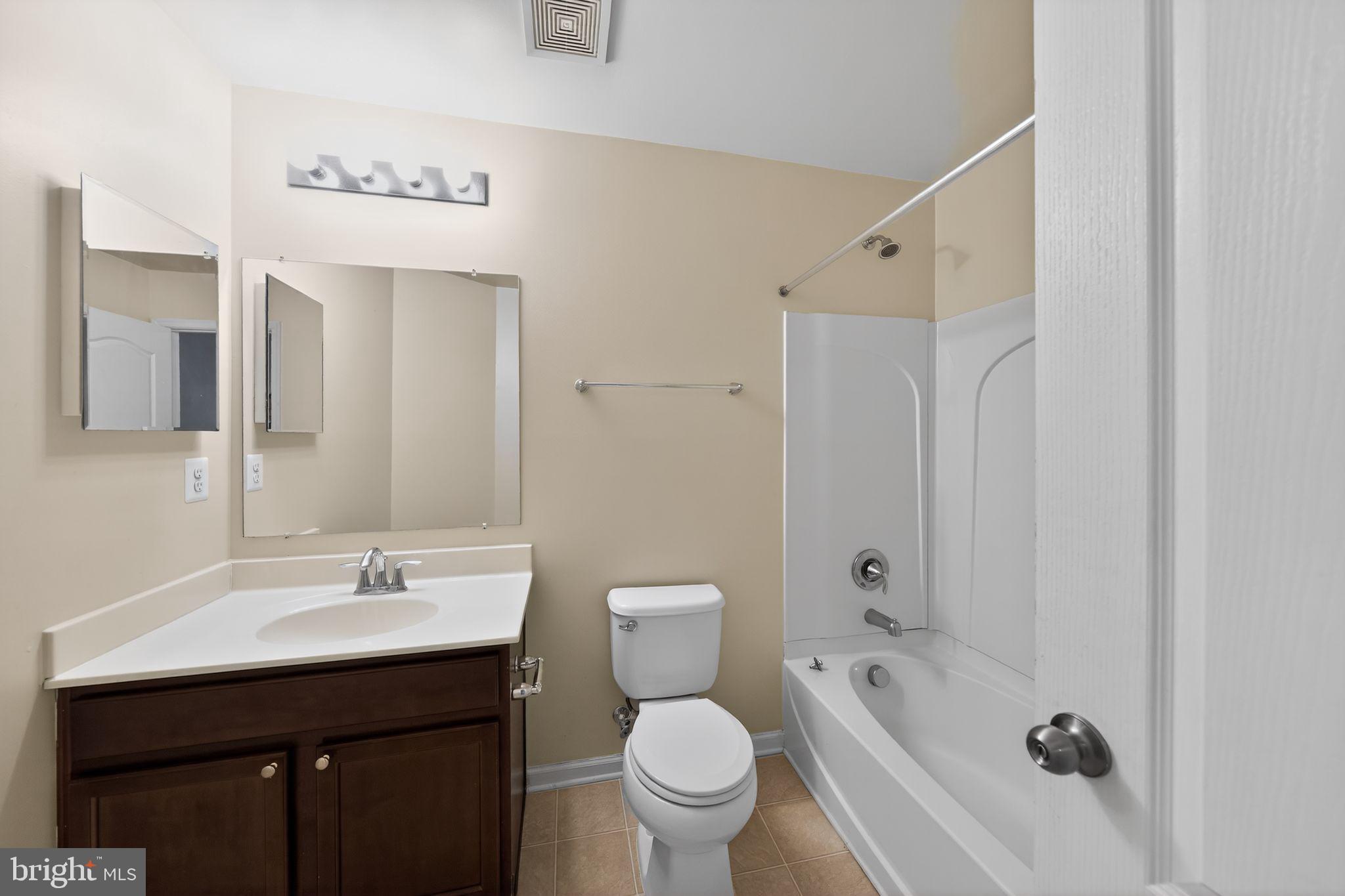 11831 Sunset Ridge Place Waldorf, MD 20602 - Photo 21 of 24 a bathroom with a sink a toilet and shower