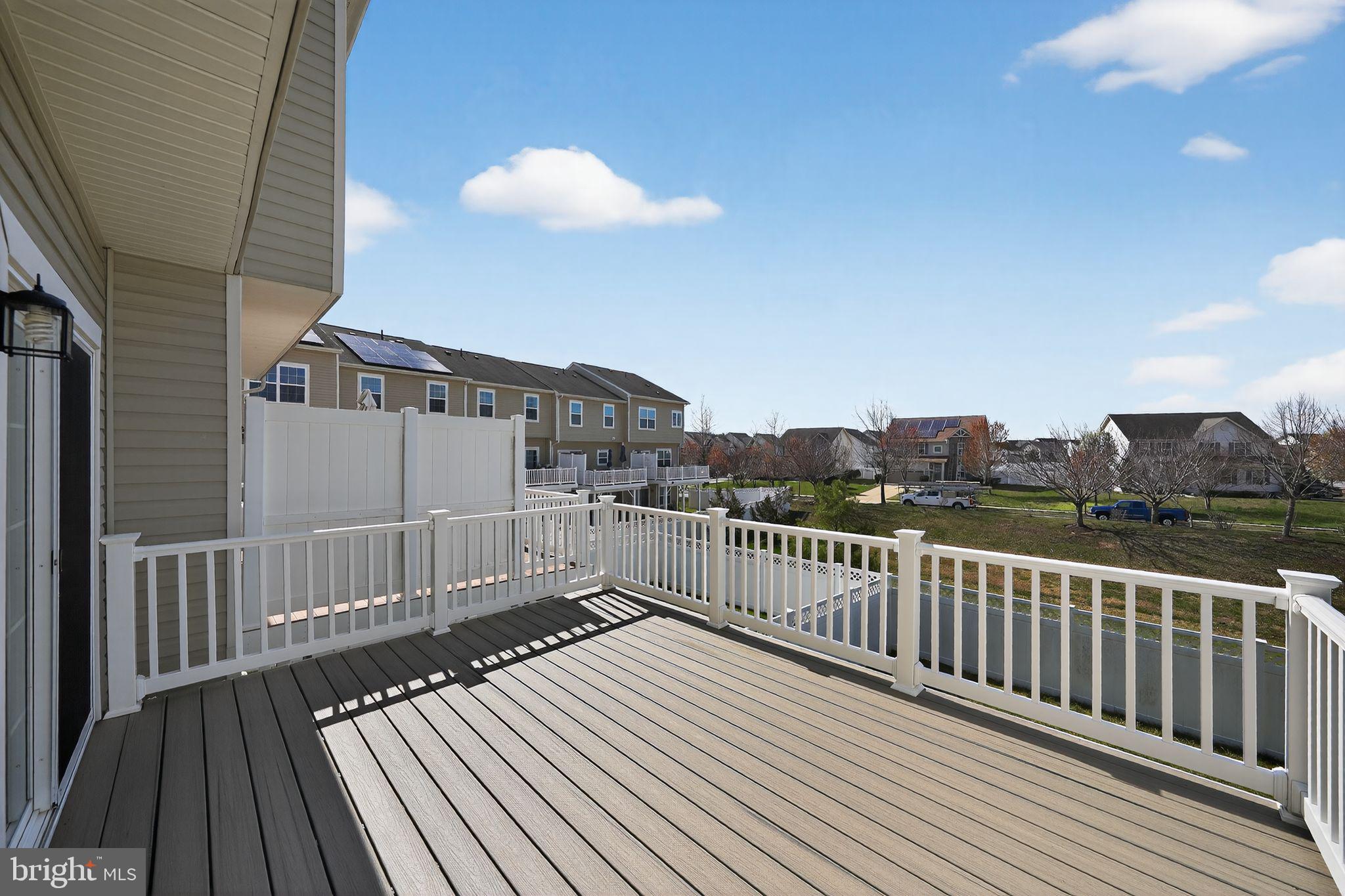11831 Sunset Ridge Place Waldorf, MD 20602 - Photo 3 of 24 a view of a balcony with wooden floor