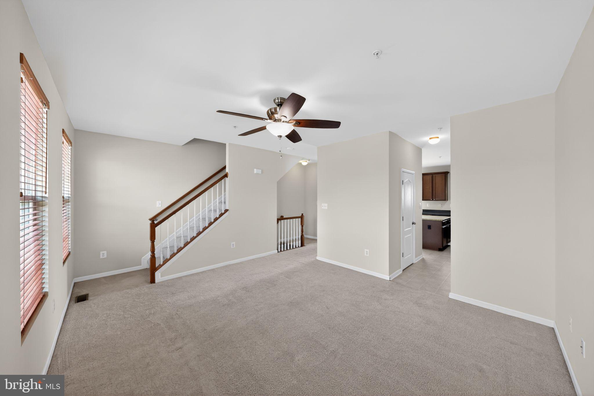 11831 Sunset Ridge Place Waldorf, MD 20602 - Photo 8 of 24 a view of empty room with stairs and mirrors