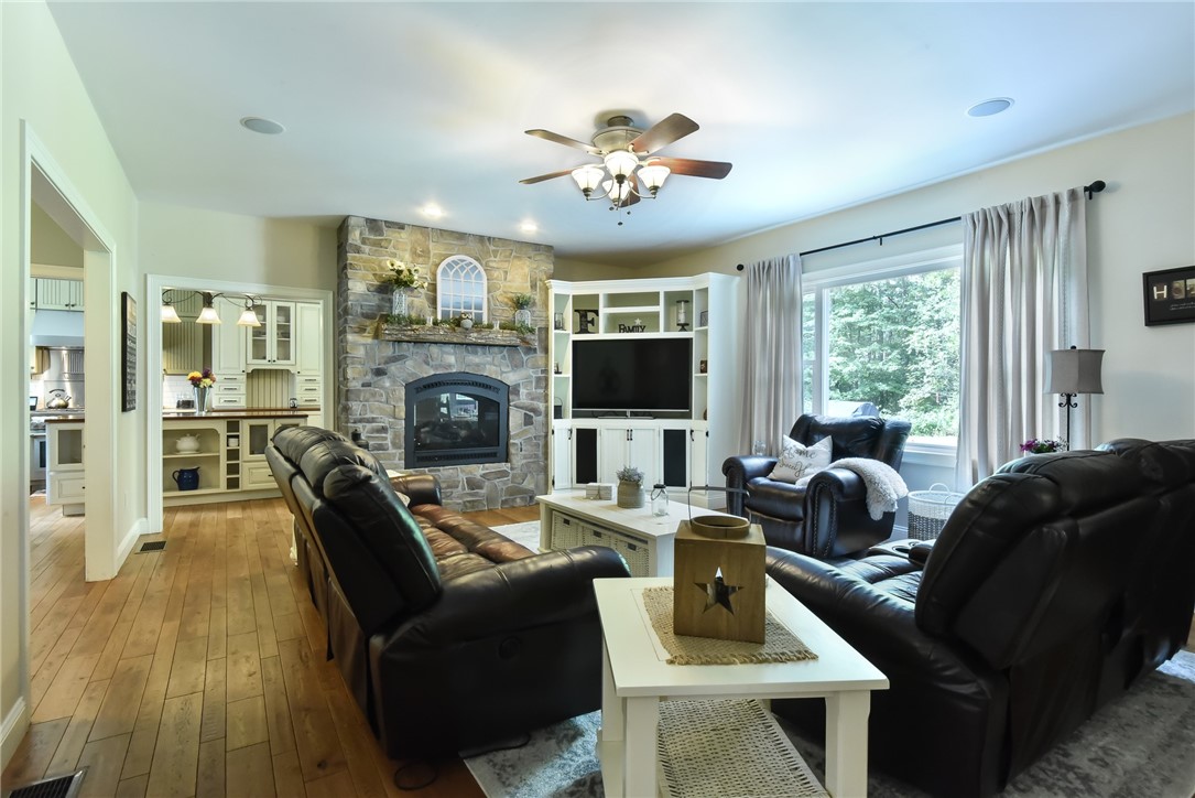 27 Preservation Drive Exeter, RI 02874 - Photo 16 of 41 Large living room with gas fireplace