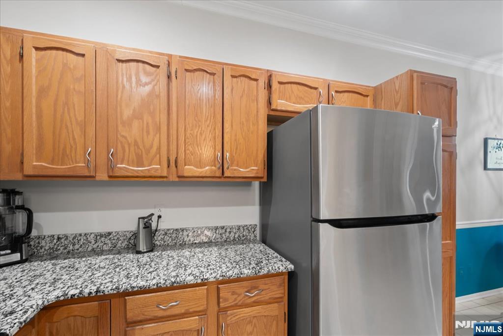 2 Richmond Road, Unit 306 West Milford, NJ 07480 - Photo 22 of 33 a kitchen with granite countertop a refrigerator and a sink