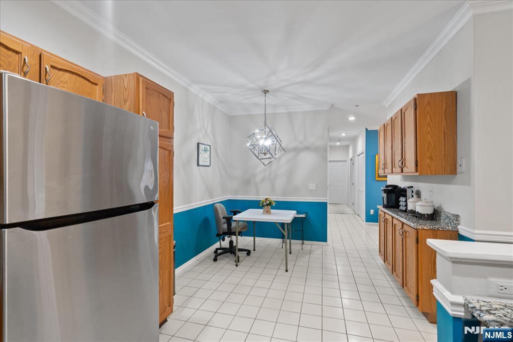 2 Richmond Road, Unit 306 West Milford, NJ 07480 - Photo 24 of 33 a kitchen with stainless steel appliances a refrigerator and a stove top oven