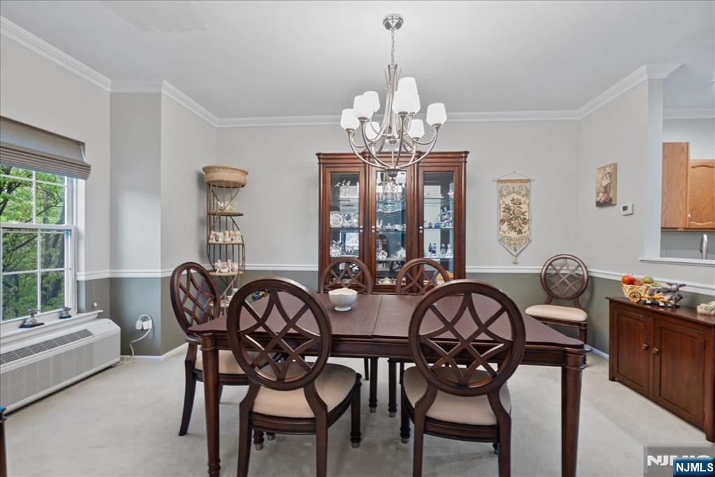 2 Richmond Road, Unit 306 West Milford, NJ 07480 - Photo 30 of 33 a view of a dining room with furniture a chandelier and window