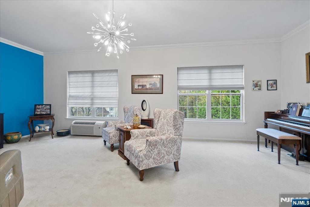 2 Richmond Road, Unit 306 West Milford, NJ 07480 - Photo 3 of 33 a living room with furniture and a large window