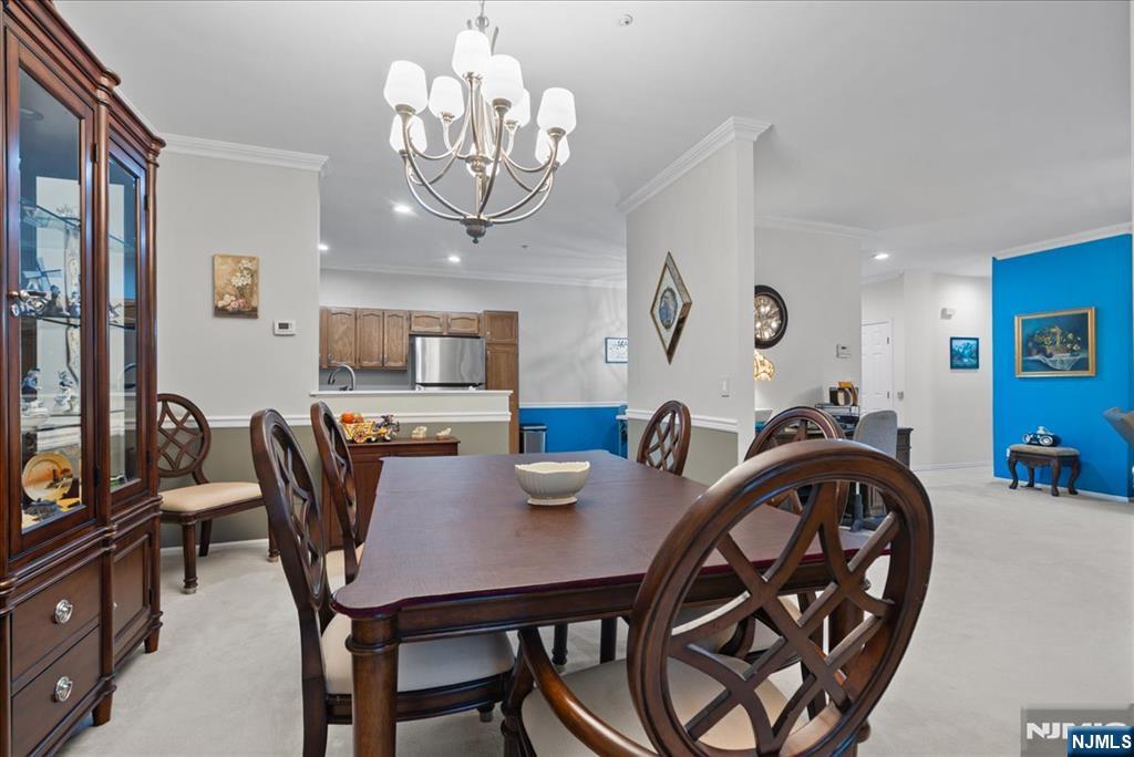 2 Richmond Road, Unit 306 West Milford, NJ 07480 - Photo 33 of 33 a view of a dining room with furniture and chandelier