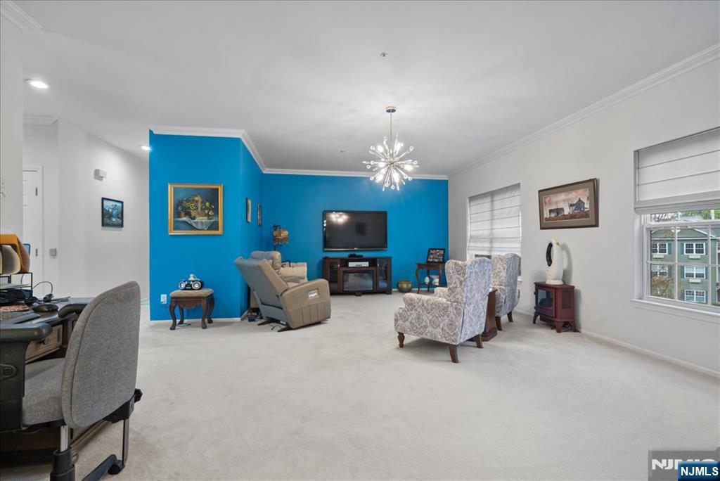 2 Richmond Road, Unit 306 West Milford, NJ 07480 - Photo 4 of 33 a living room with furniture and a chandelier