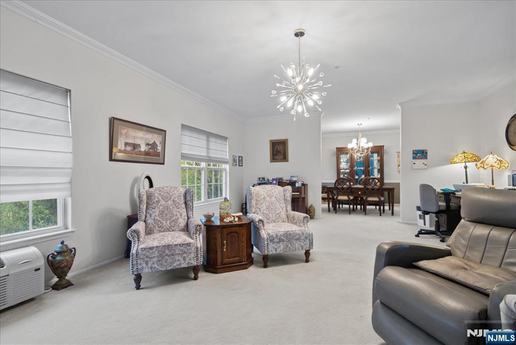 2 Richmond Road, Unit 306 West Milford, NJ 07480 - Photo 6 of 33 a living room with furniture and a chandelier