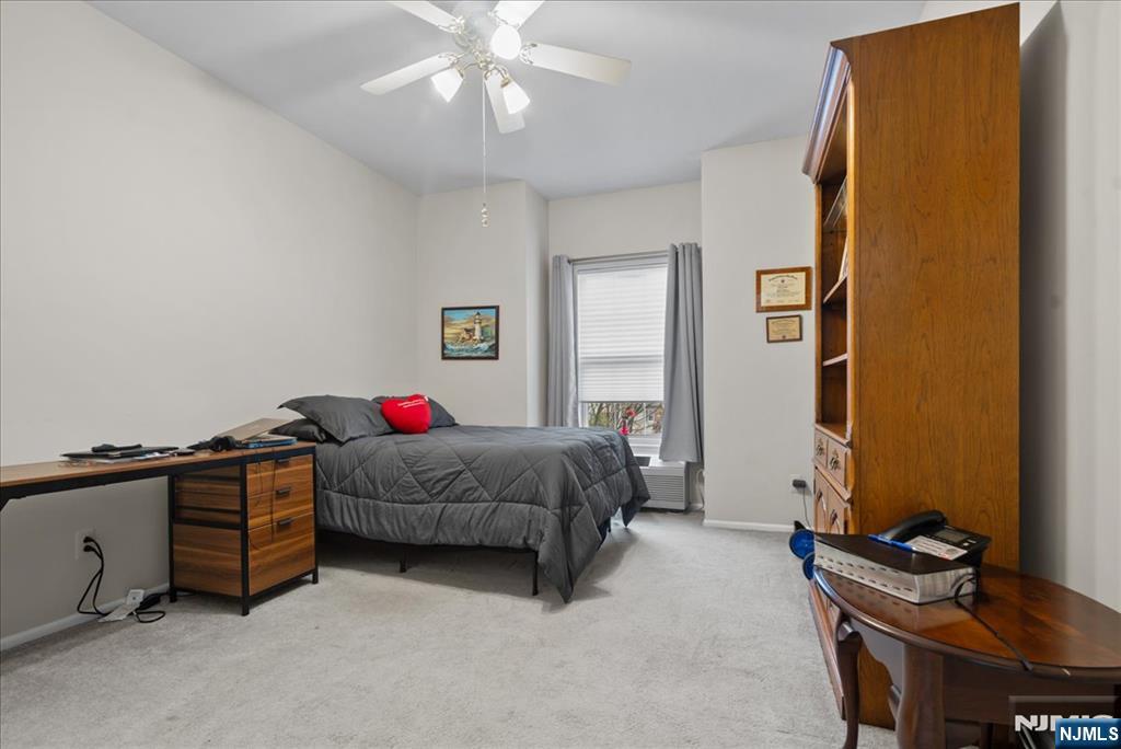 2 Richmond Road, Unit 306 West Milford, NJ 07480 - Photo 8 of 33 a living room with a bed furniture and a window