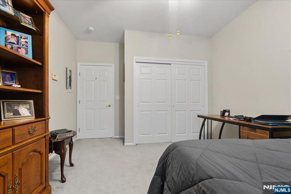 2 Richmond Road, Unit 306 West Milford, NJ 07480 - Photo 9 of 33 a bedroom with a bed and dresser