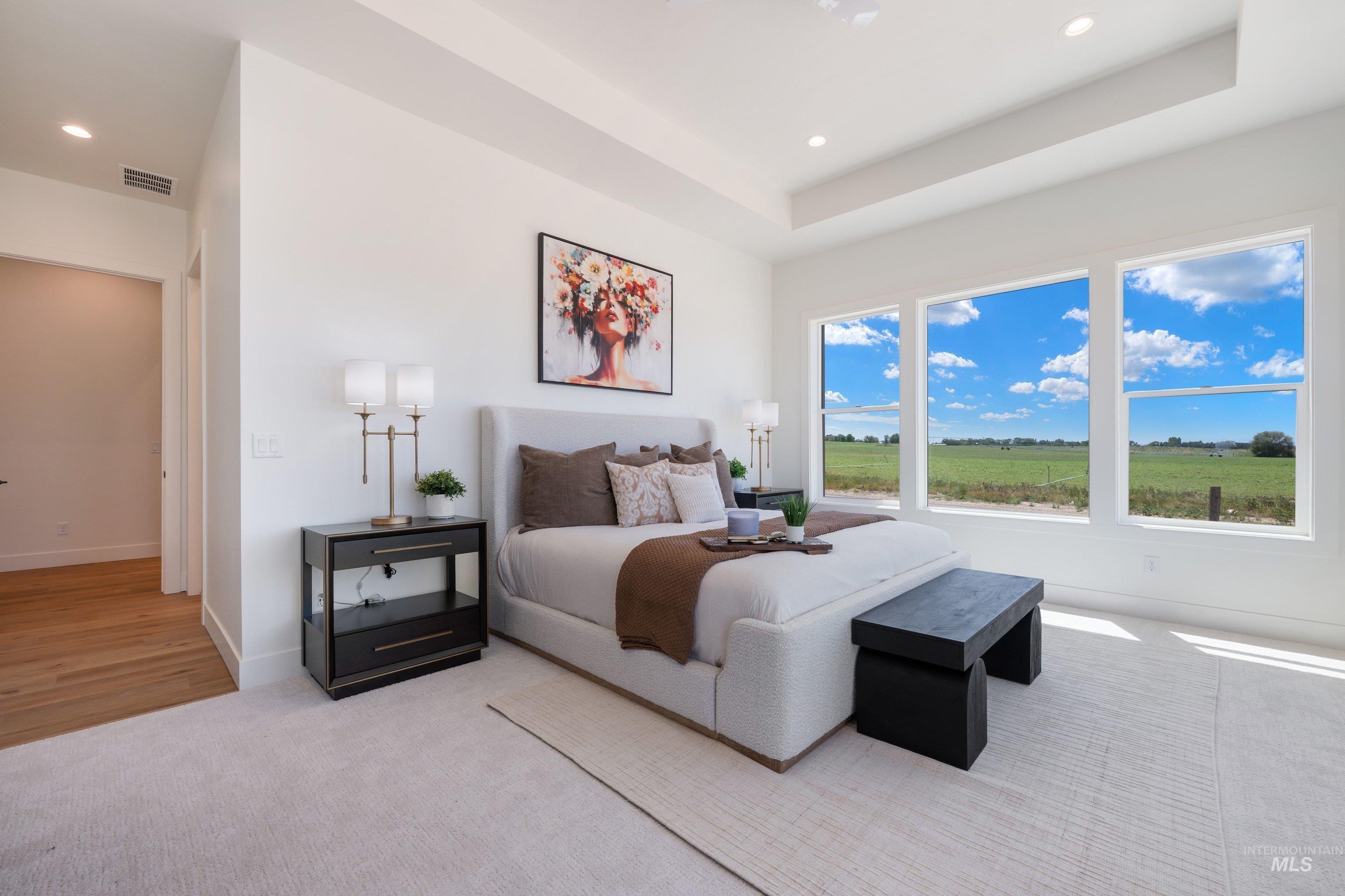 24821 Ardmore Court Caldwell, ID 83607 - Photo 38 of 43 Spacious room featuring three large windows showcasing expansive green fields