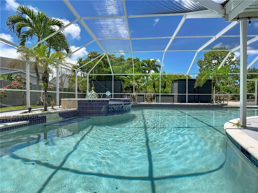 2280 Capri Court Naples, FL 34105 - Photo 33 of 49 a view of a backyard with plants and a patio