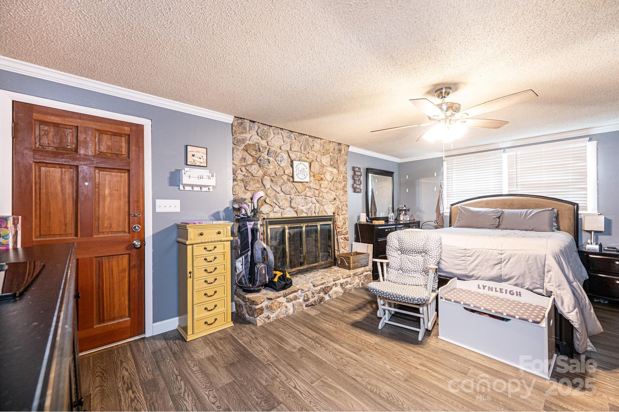 2841 21st Street Northeast Hickory, NC 28601 - Photo 11 of 43 a bedroom with a bed a couch and a window with the outer view