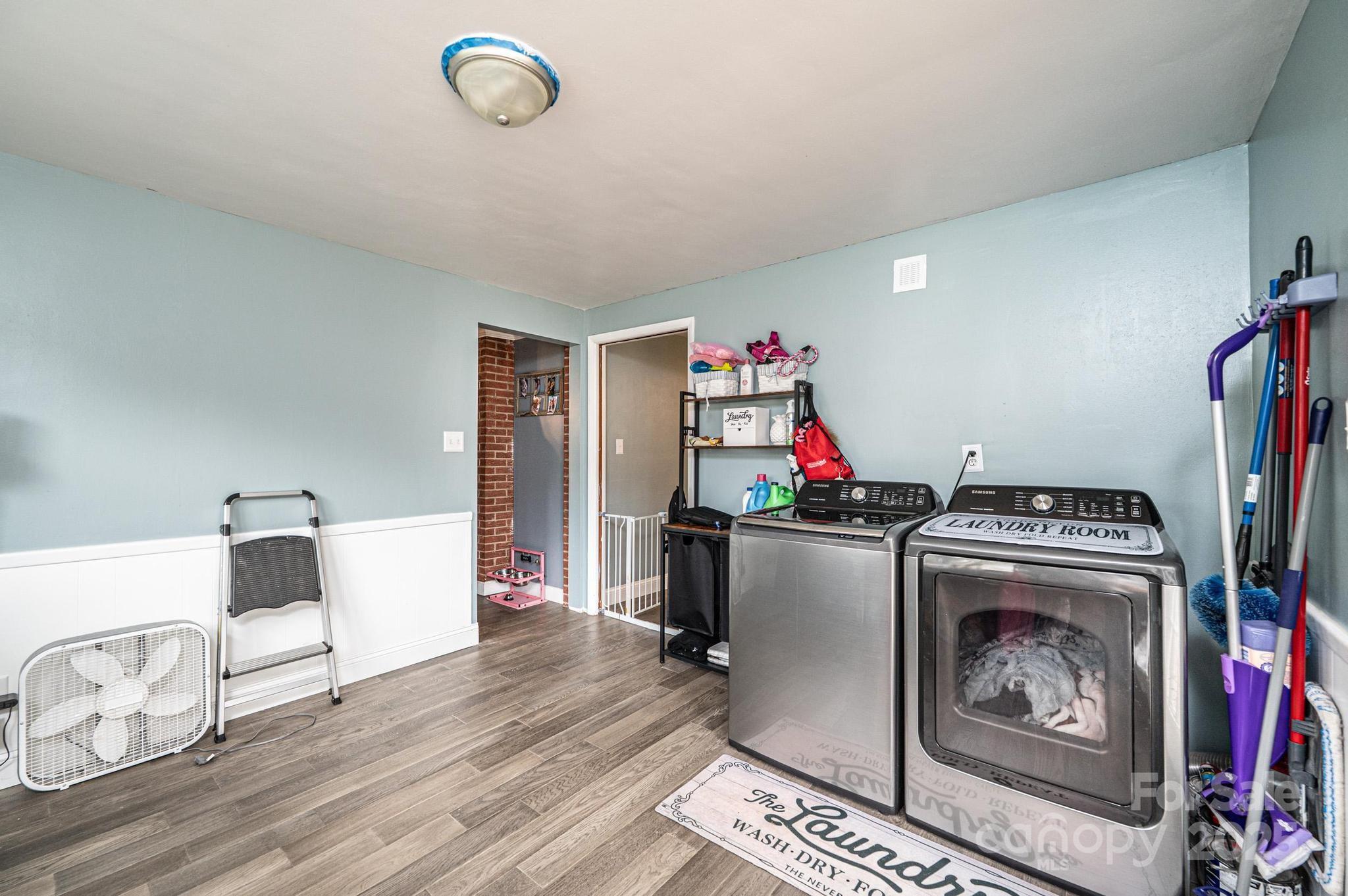 2841 21st Street Northeast Hickory, NC 28601 - Photo 18 of 43 a view of a dining room with furniture wooden floor and front door