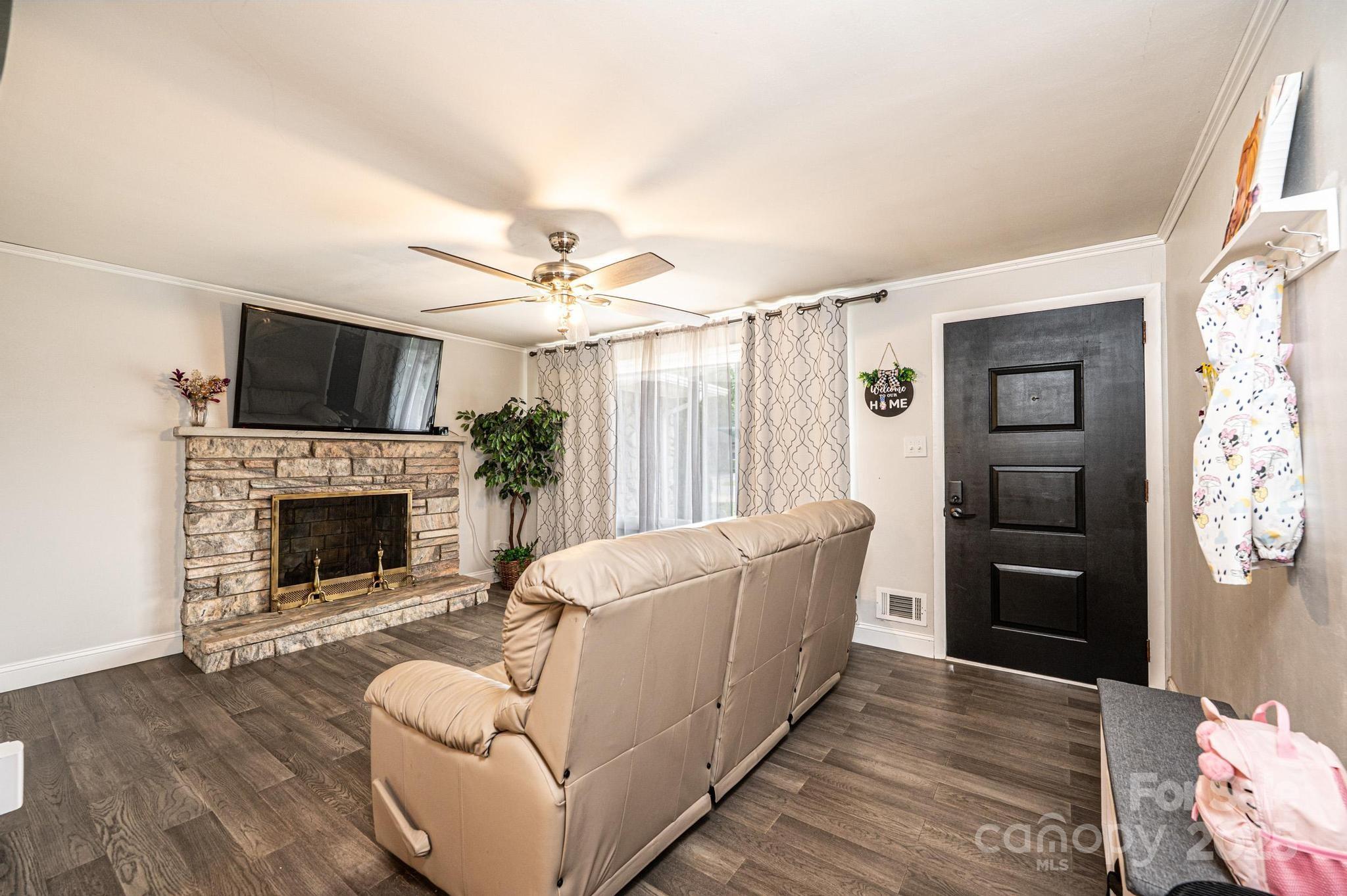 2841 21st Street Northeast Hickory, NC 28601 - Photo 3 of 43 a living room with furniture and a fireplace