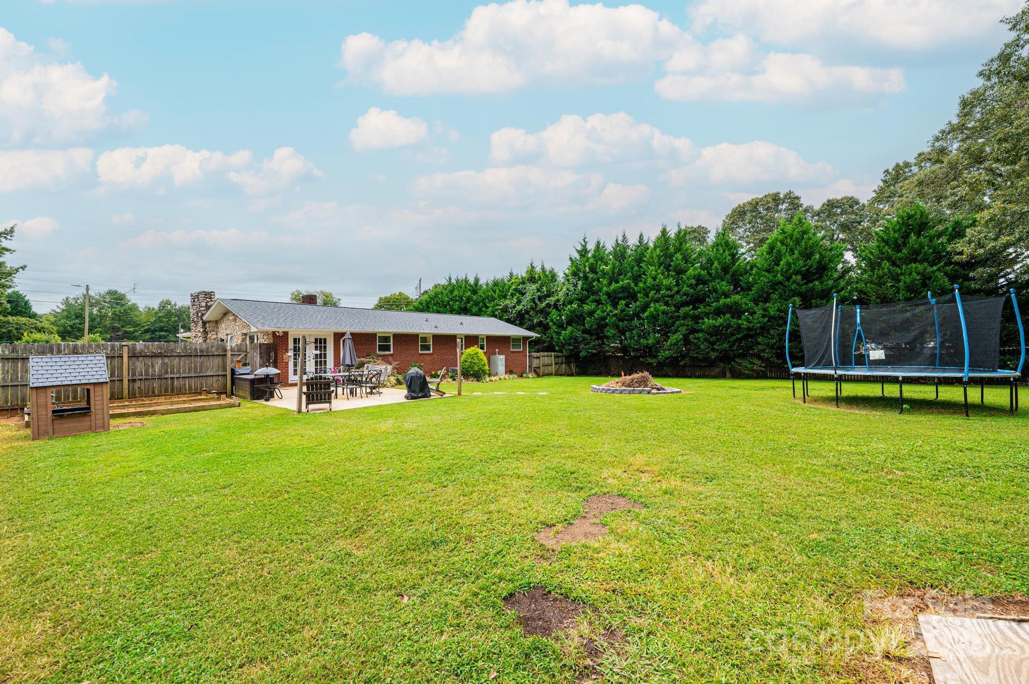 2841 21st Street Northeast Hickory, NC 28601 - Photo 39 of 43 a view of a swimming pool with a table and chairs