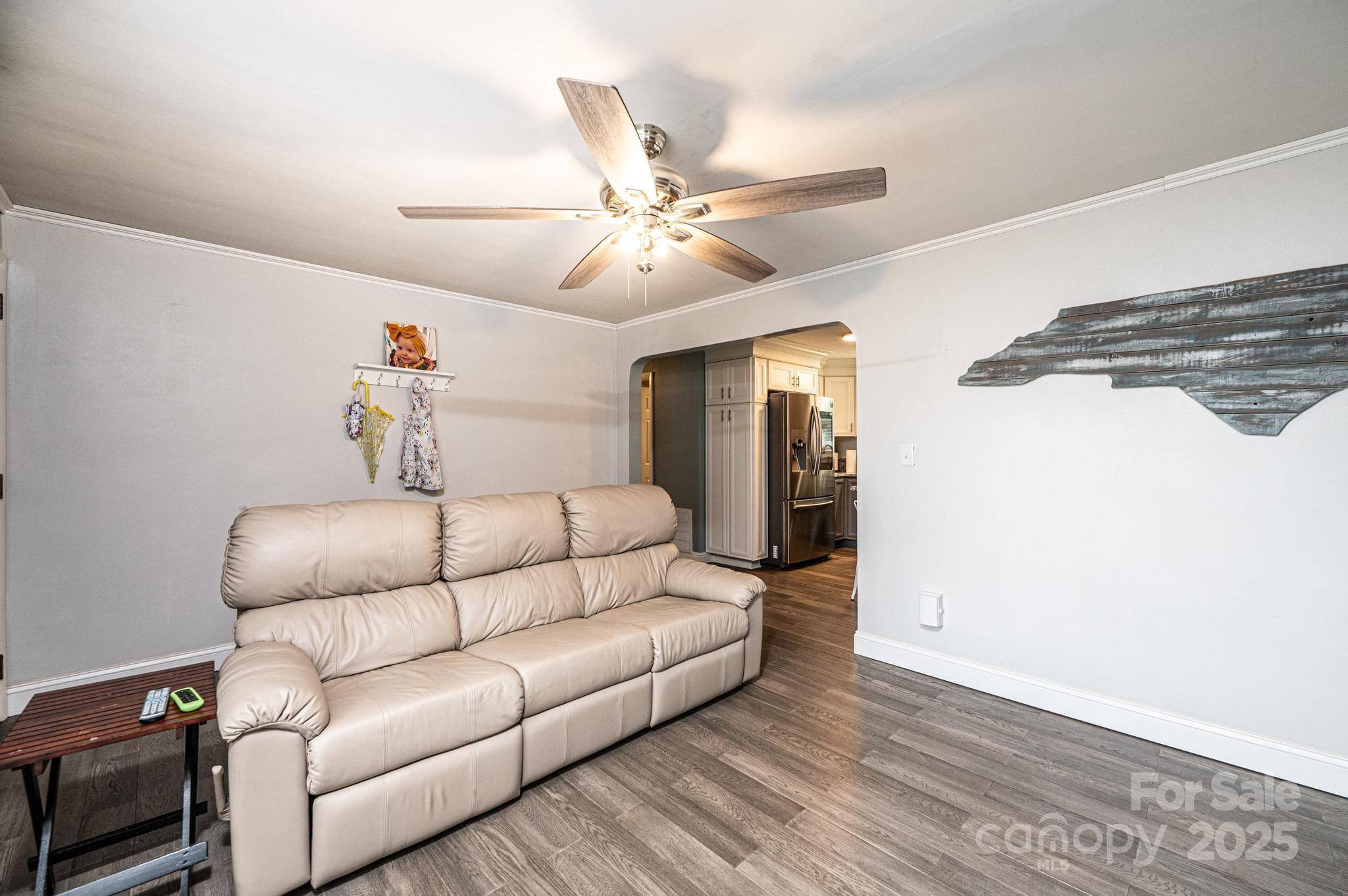 2841 21st Street Northeast Hickory, NC 28601 - Photo 5 of 43 a living room with furniture and a ceiling fan
