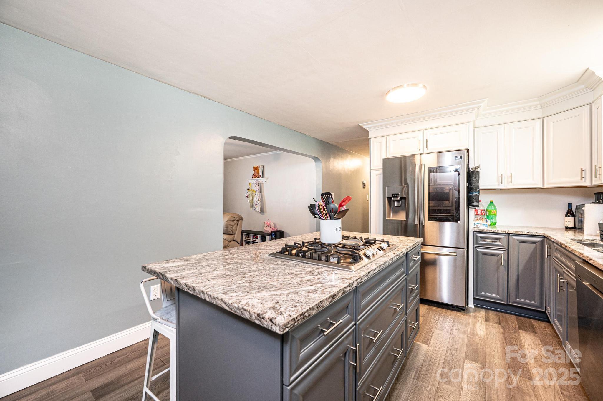 2841 21st Street Northeast Hickory, NC 28601 - Photo 10 of 43 a kitchen with stainless steel appliances granite countertop a sink stove and refrigerator