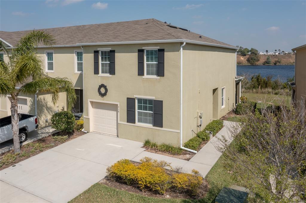 316 Arbor Lakes Drive Davenport, FL 33896 - Photo 1 of 32 a front view of a house with a yard