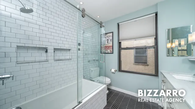 a bathroom with a double vanity sink and mirror