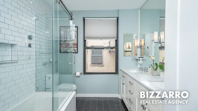 a bathroom with a bathtub and shower
