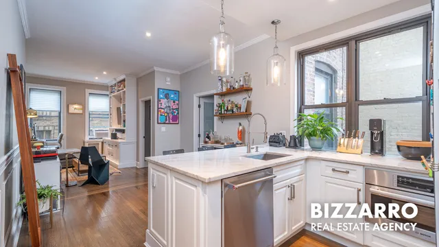 a kitchen with stainless steel appliances a sink and a stove