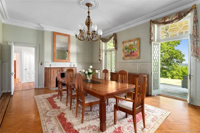 a view of a dining room with furniture window and wooden floor