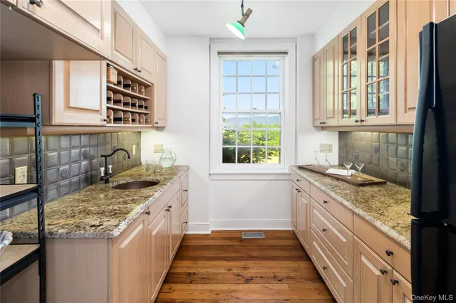 a kitchen with a stove and a sink