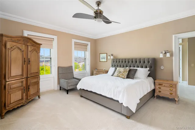 a bedroom with a bed dresser and a window