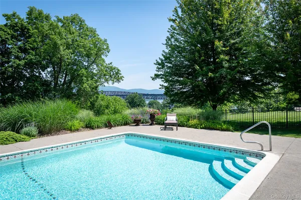 a view of a swimming pool with a patio