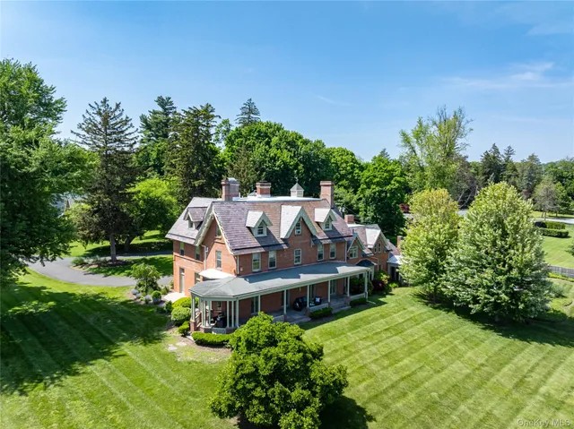 an aerial view of a house with big yard