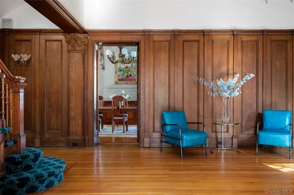 a living room with furniture and a chair
