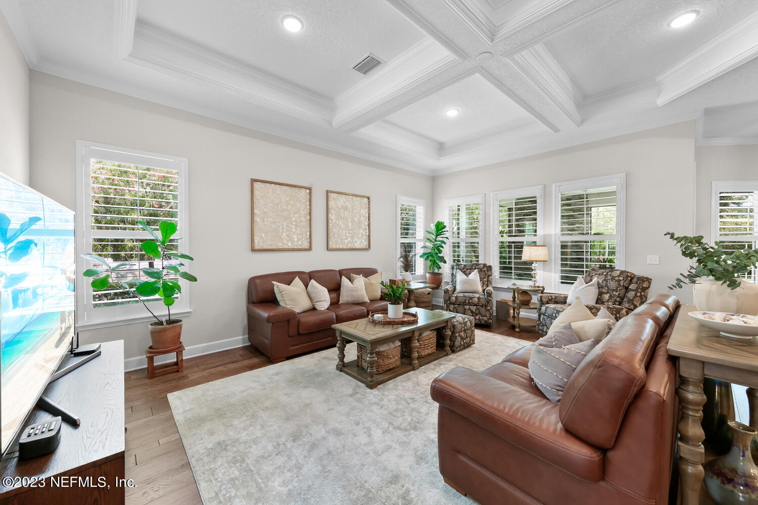 110 Pine Manor Drive Jacksonville, FL 32081 - Photo 17 of 55 a living room with furniture potted plant and windows