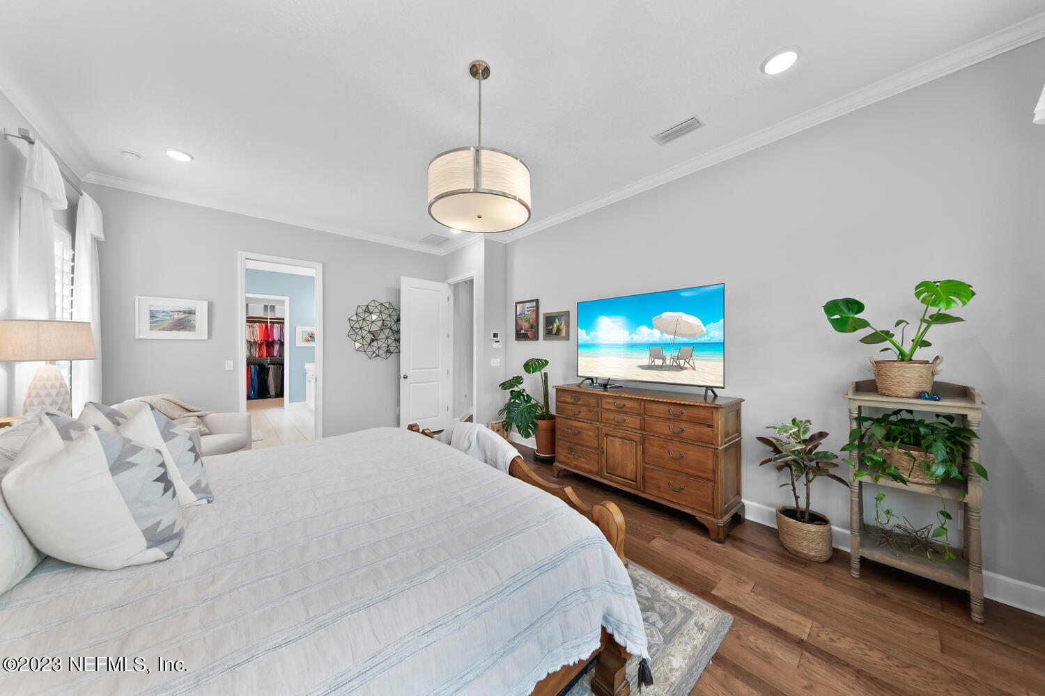 110 Pine Manor Drive Jacksonville, FL 32081 - Photo 21 of 55 a bedroom with a bed and a chandelier