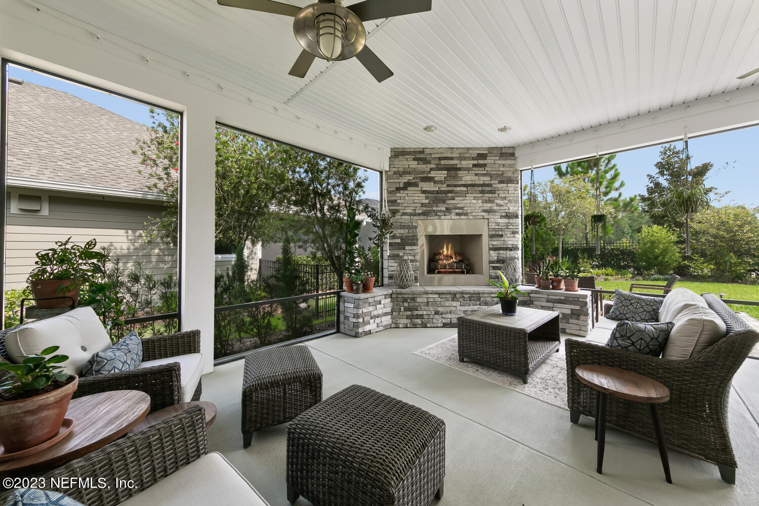 110 Pine Manor Drive Jacksonville, FL 32081 - Photo 29 of 55 a living room with furniture fireplace and large windows