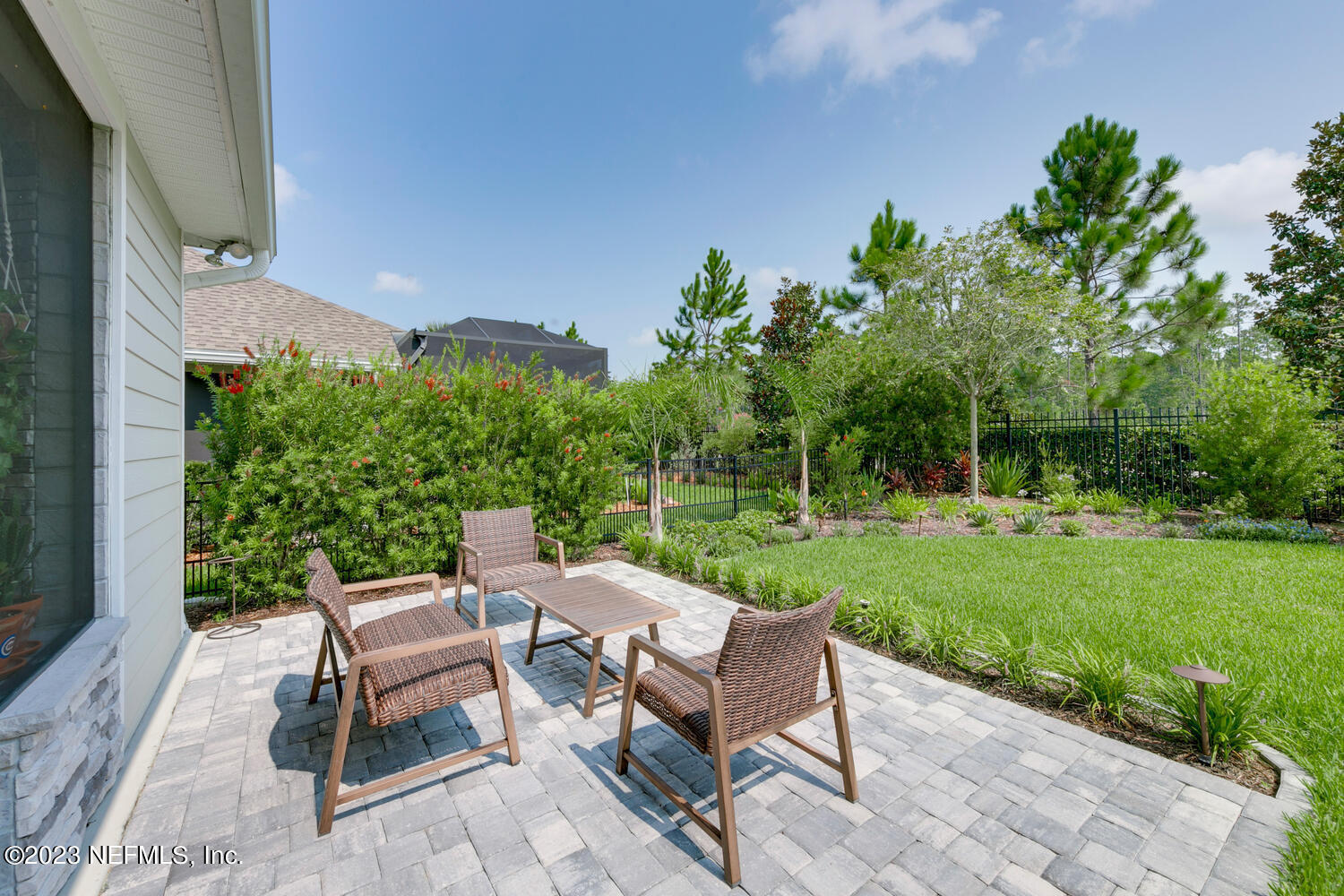 110 Pine Manor Drive Jacksonville, FL 32081 - Photo 32 of 55 a view of a backyard with sitting area furniture and garden