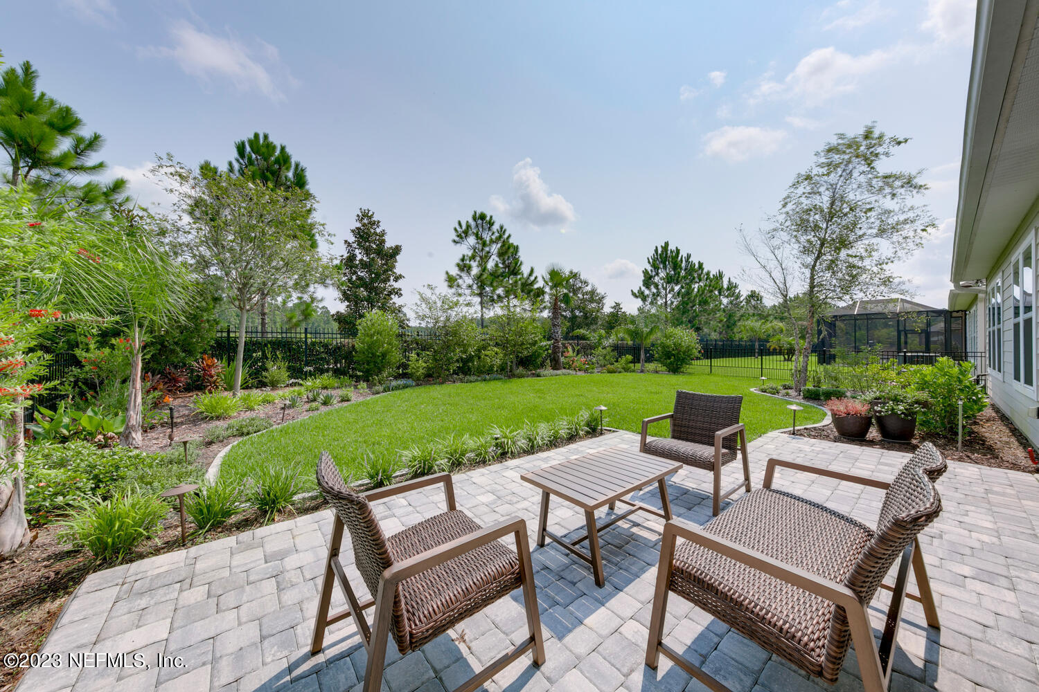 110 Pine Manor Drive Jacksonville, FL 32081 - Photo 33 of 55 a view of a patio with couches chairs potted plants and a big yard