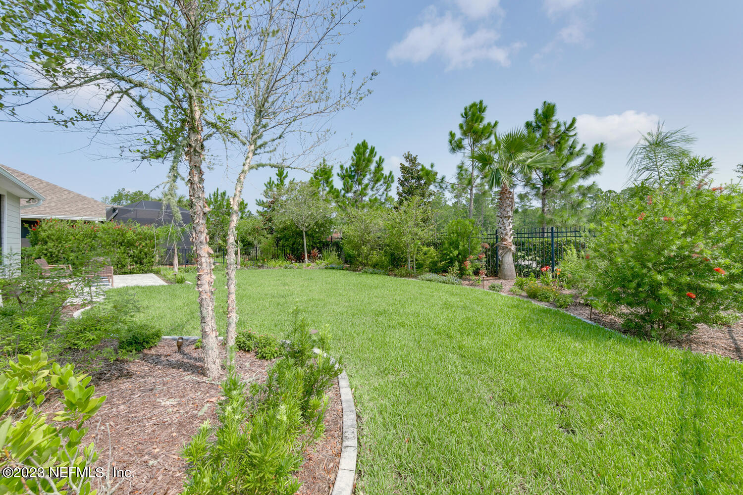 110 Pine Manor Drive Jacksonville, FL 32081 - Photo 34 of 55 a view of a garden with a tree